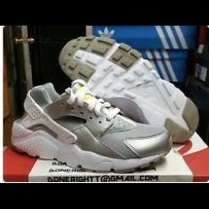Nike huarache run metallic silver.